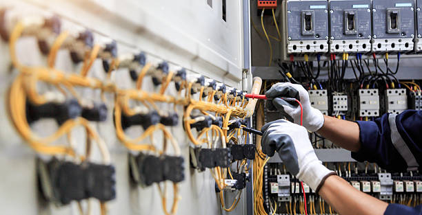 Professional Electrician technician working in North Pembroke, MA